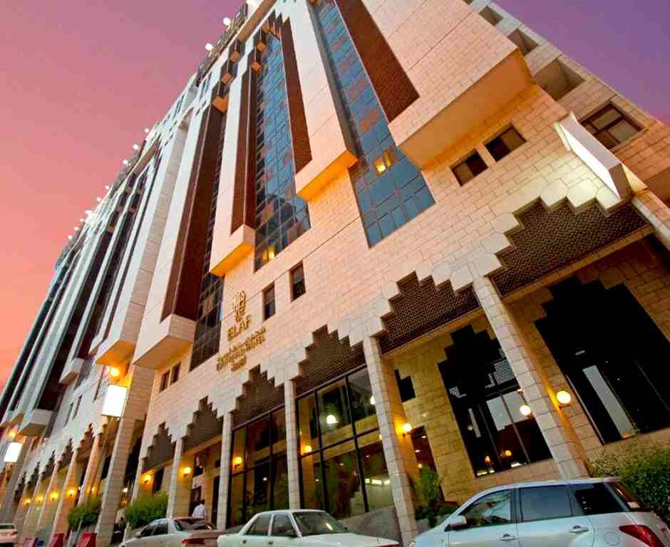 Exterior view of Elaf Ajyad Hotel in Makkah with sunset sky in the background